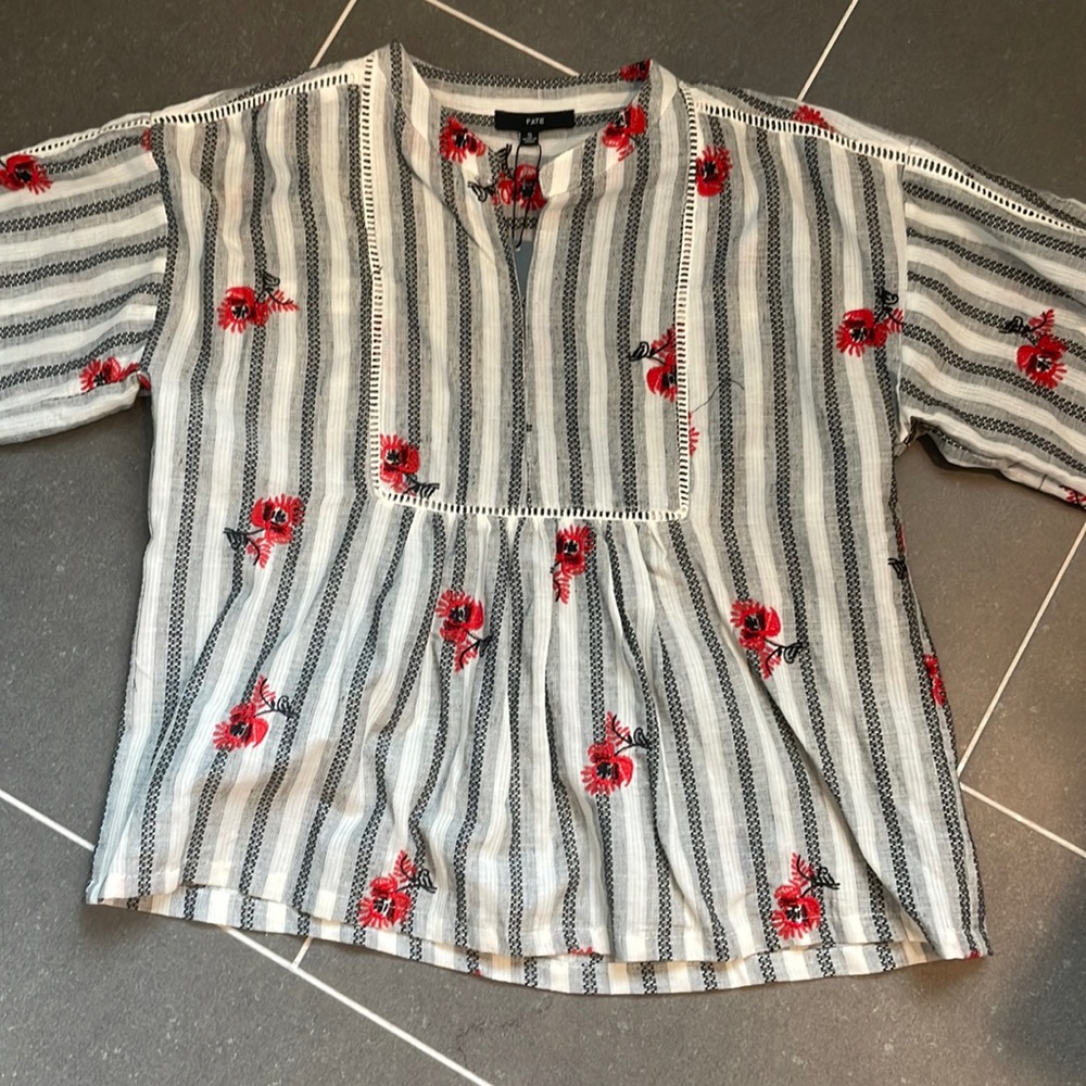 Embroidered peplum blouse